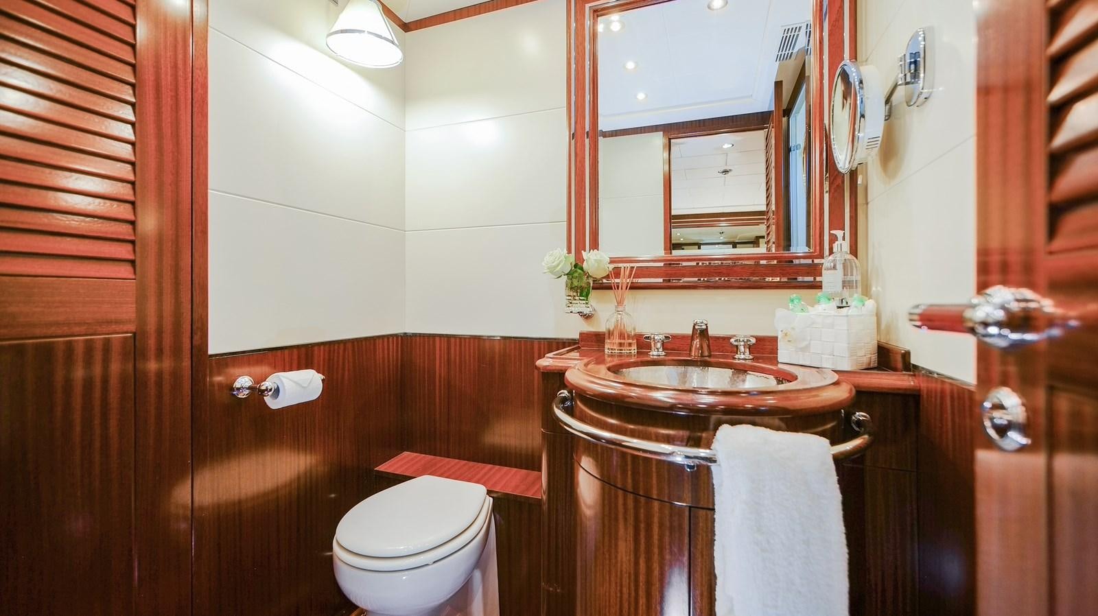 a bathroom with a sink and toilet aboard VANISH Yacht for Sale