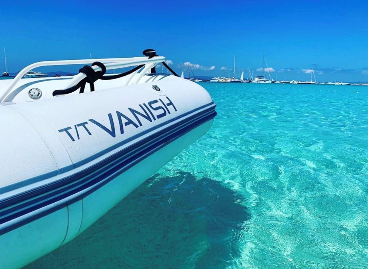 a speed boat in the water aboard VANISH Yacht for Sale
