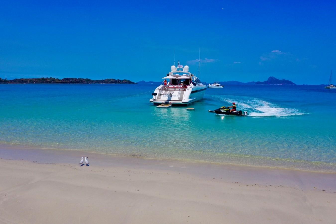 a couple of boats in the water aboard VANISH Yacht for Sale