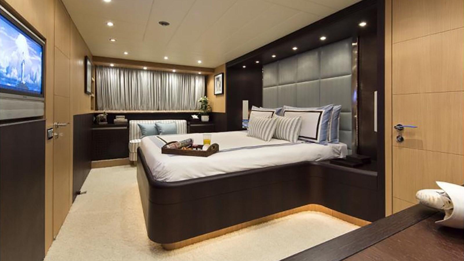a room with a bed and a tv aboard ASHA Yacht for Sale
