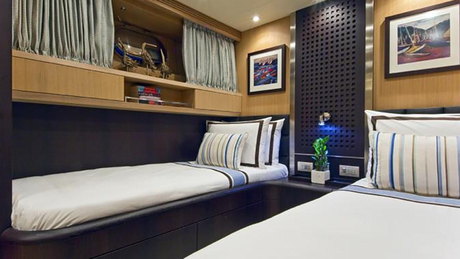 a room with two beds aboard ASHA Yacht for Sale