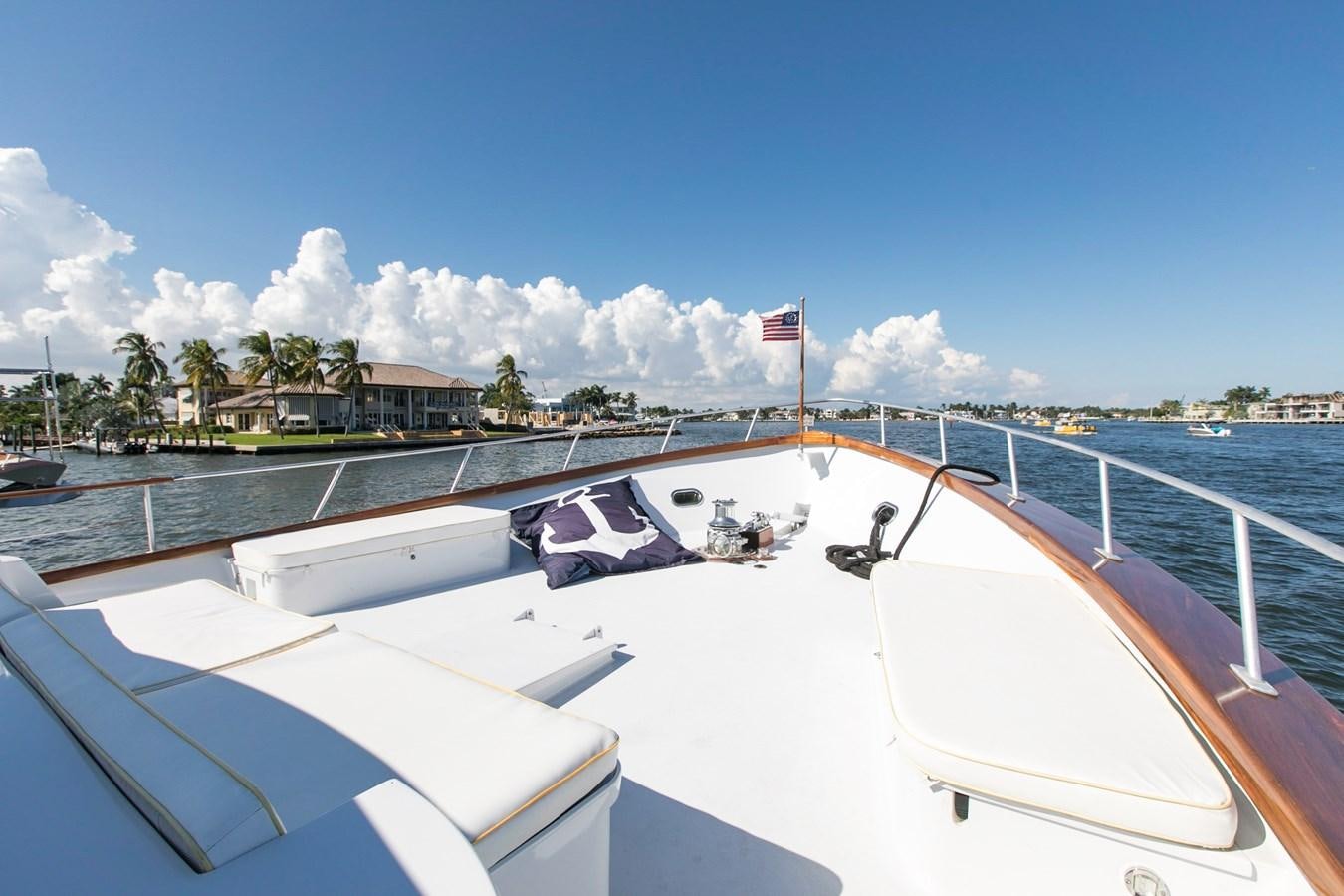 a large white boat with flags on it aboard TRES HERMANOS VI Yacht for Sale