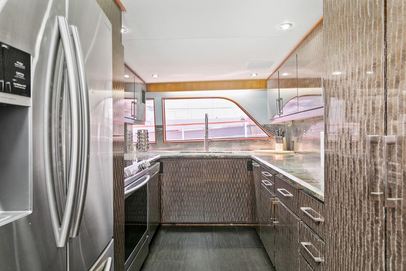 a kitchen with stainless steel appliances aboard TRES HERMANOS VI Yacht for Sale