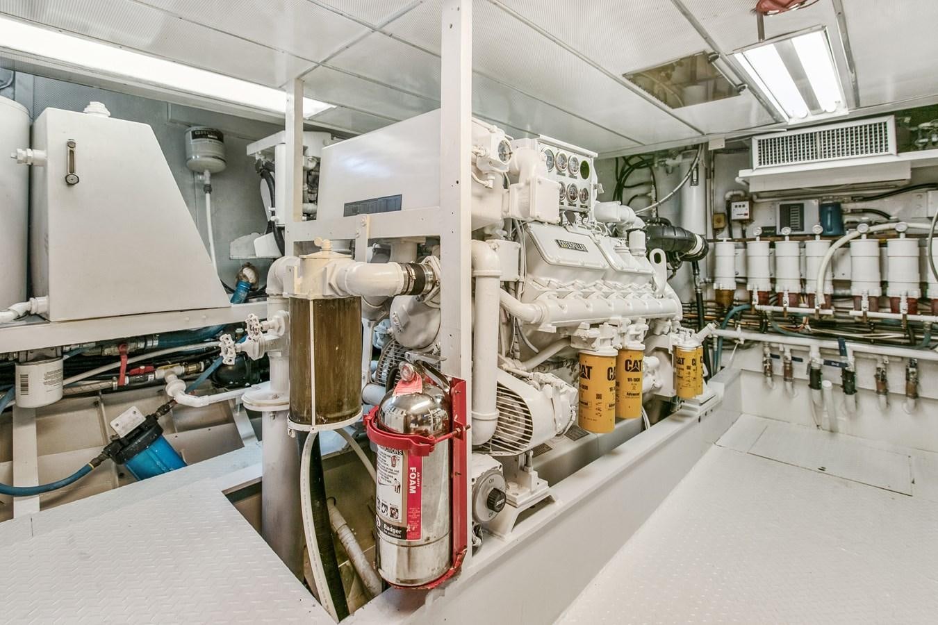 a room with several machines aboard TRES HERMANOS VI Yacht for Sale