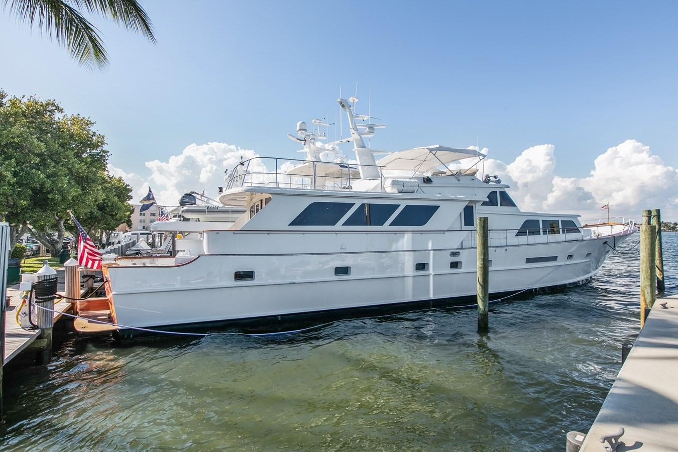 a large white boat docked aboard TRES HERMANOS VI Yacht for Sale