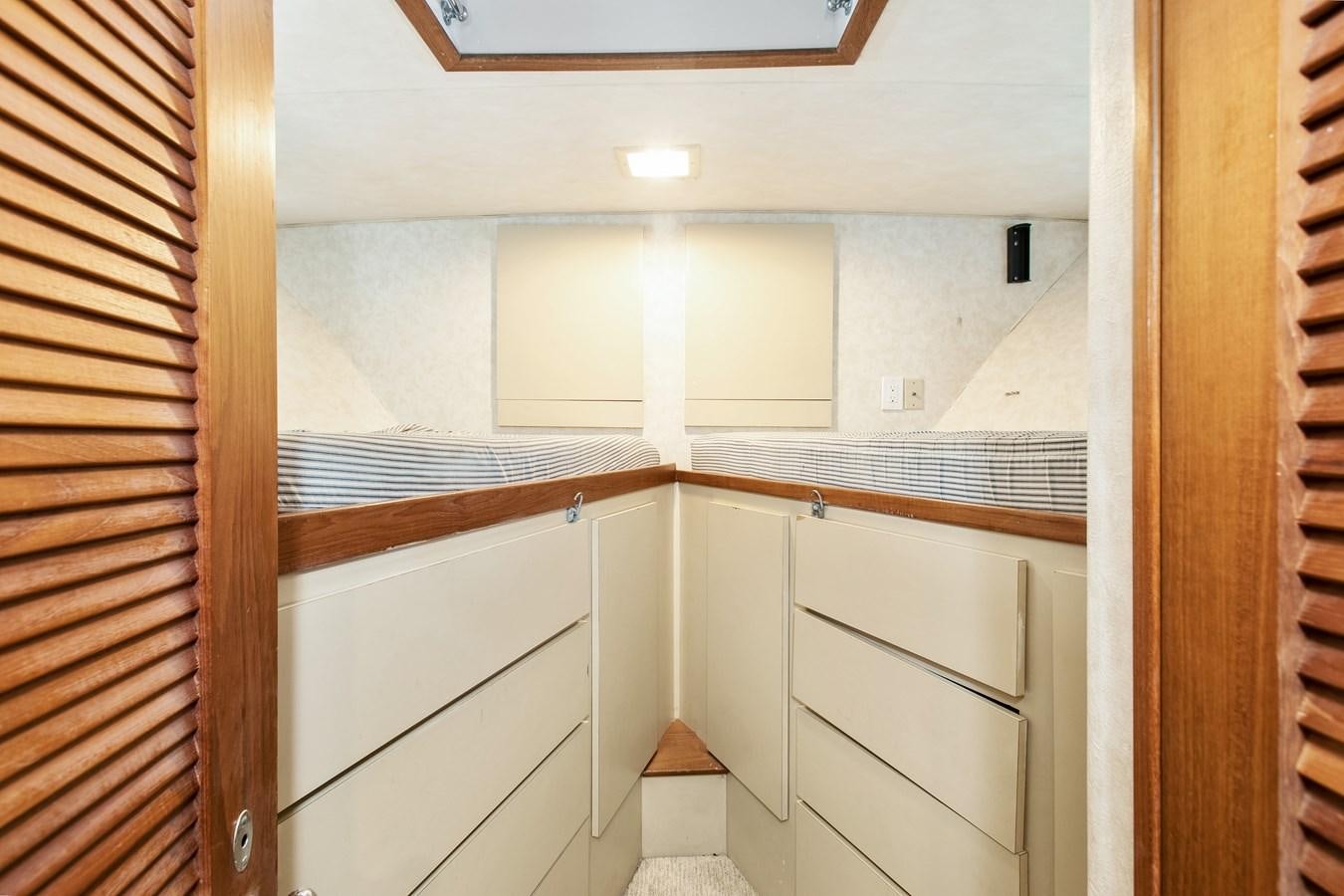 a room with white cabinets aboard TRES HERMANOS VI Yacht for Sale