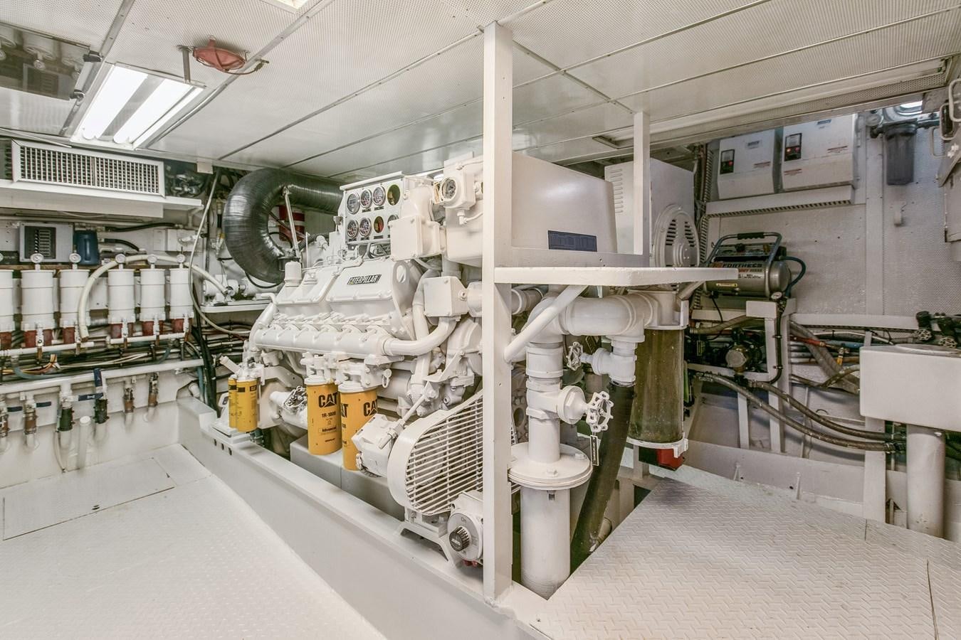 a room with machinery aboard TRES HERMANOS VI Yacht for Sale