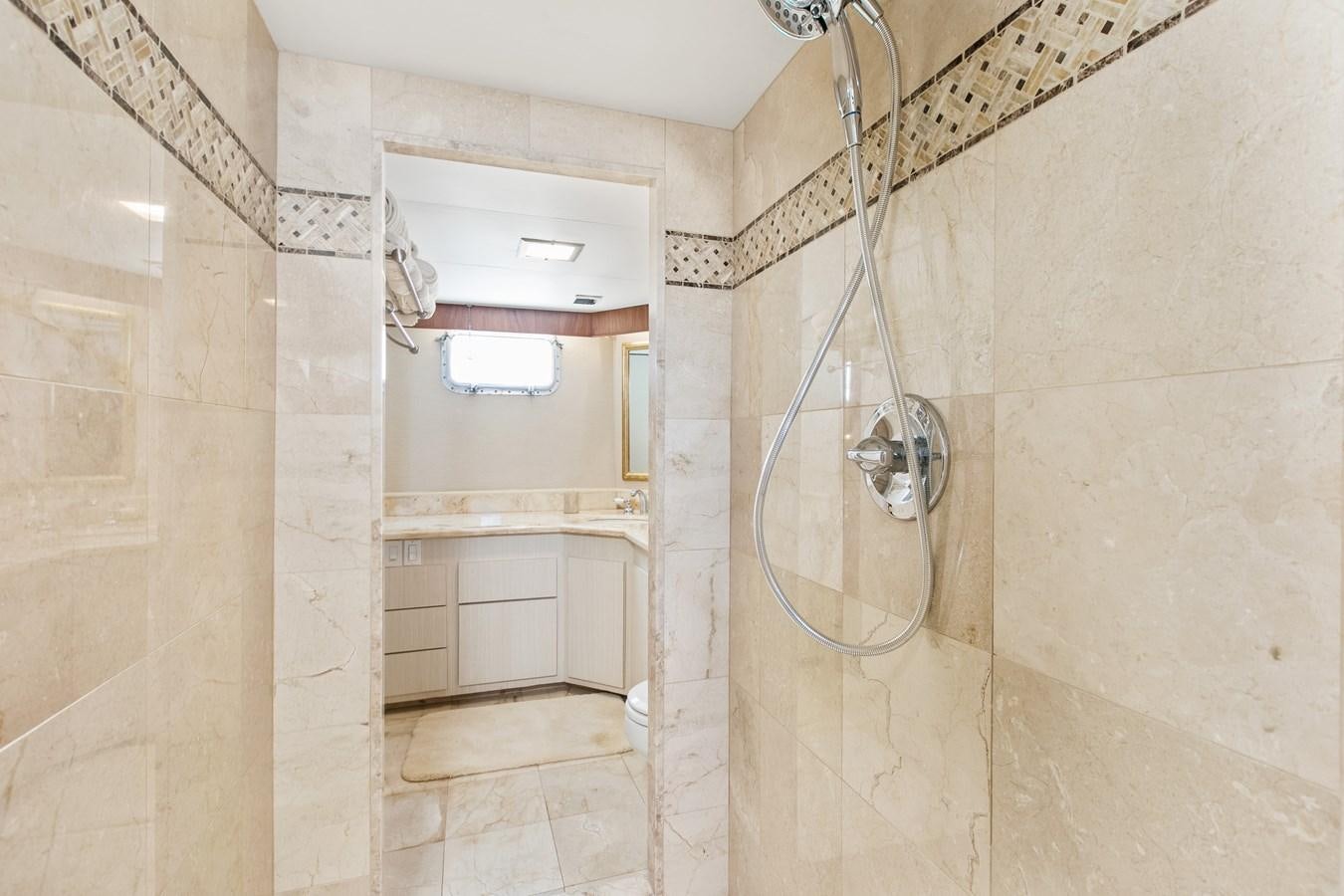 a shower unit in a bathroom aboard TRES HERMANOS VI Yacht for Sale