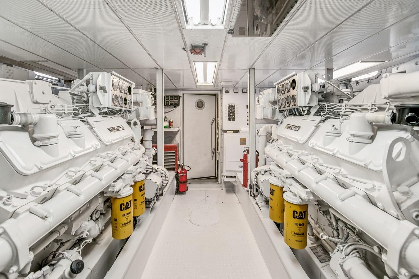 a room with white machines aboard TRES HERMANOS VI Yacht for Sale