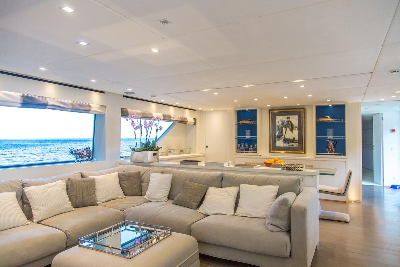 a living room with a large window aboard MAI Yacht for Sale