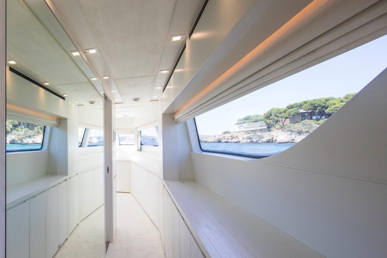 a room with a view of the ocean and the land aboard MAI Yacht for Sale