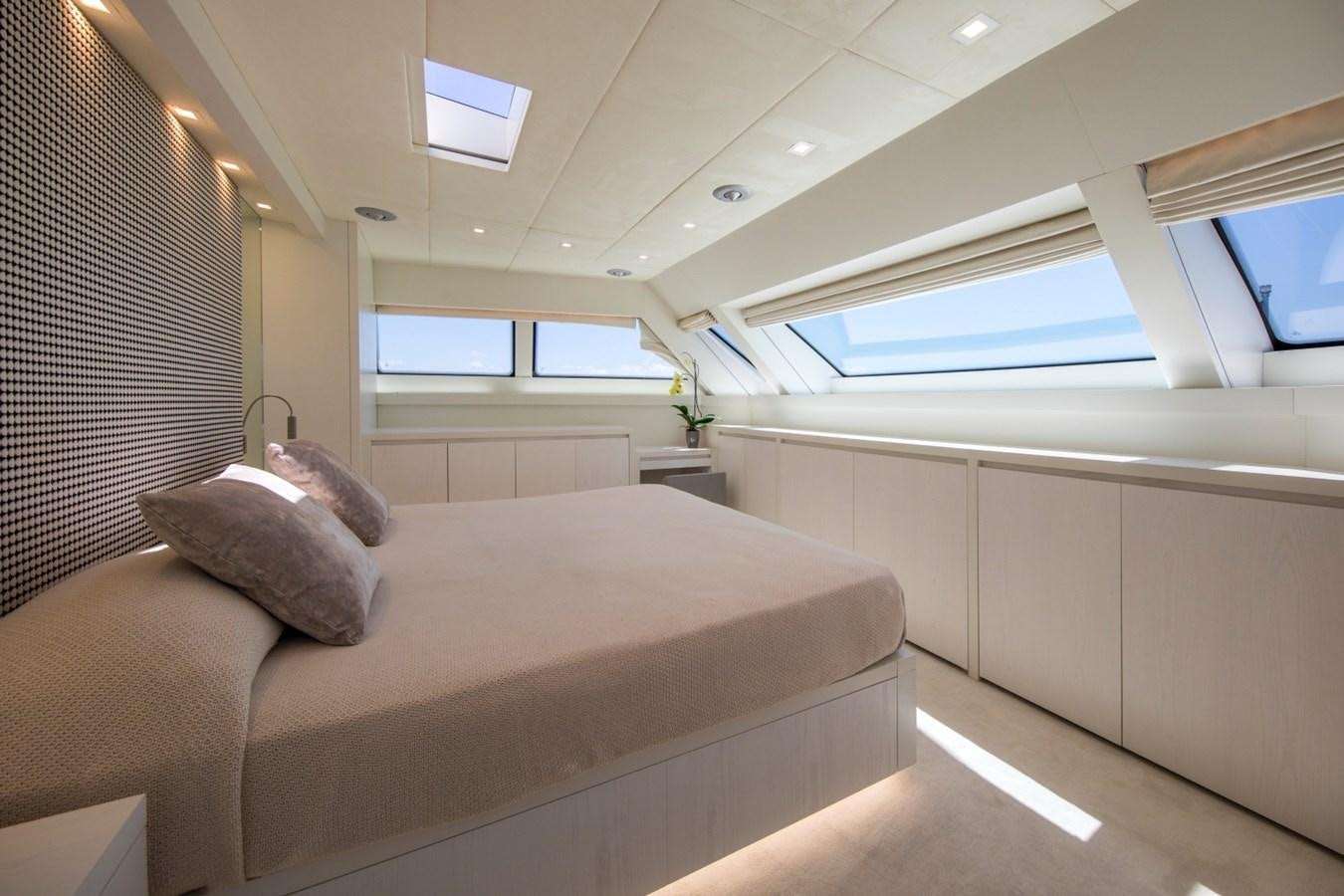 a person sleeping on a couch aboard MAI Yacht for Sale