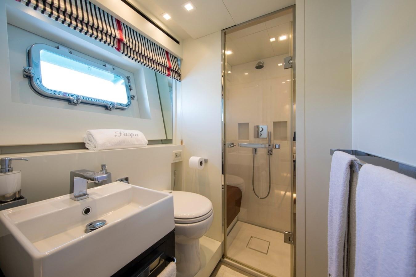 a bathroom with a glass shower aboard MAI Yacht for Sale