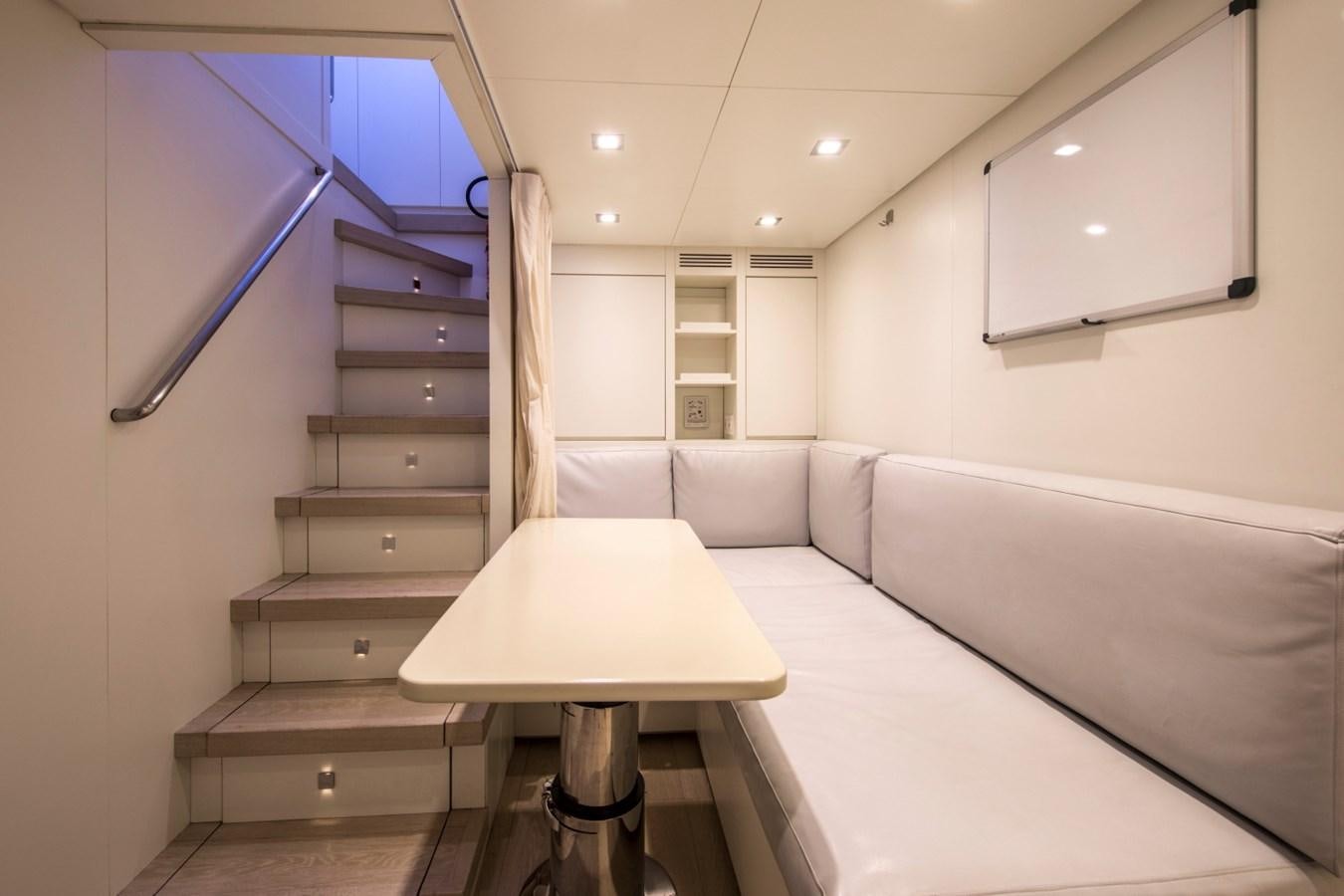 a room with a bed and a table aboard MAI Yacht for Sale