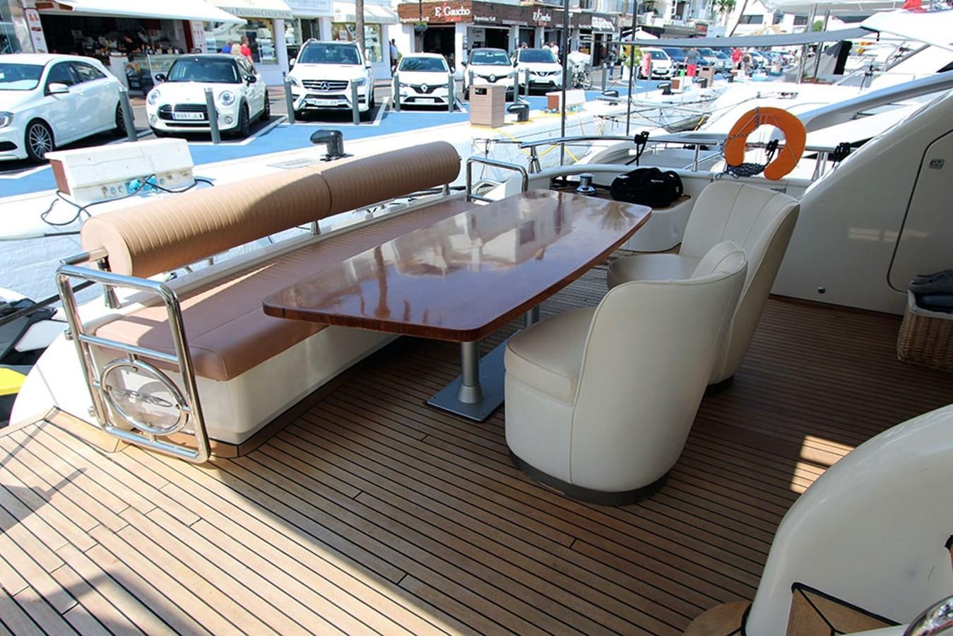 a table with chairs on it aboard HAIGAN Yacht for Sale