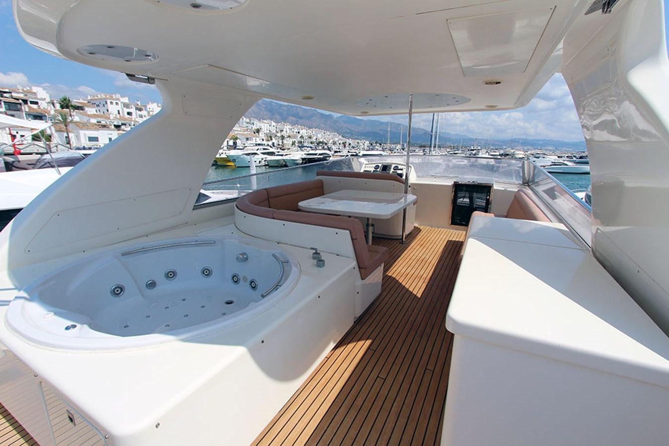 a room with a large window overlooking a city and water aboard HAIGAN Yacht for Sale