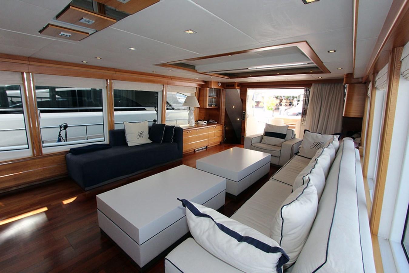 a living room with a couch and a table aboard HAIGAN Yacht for Sale