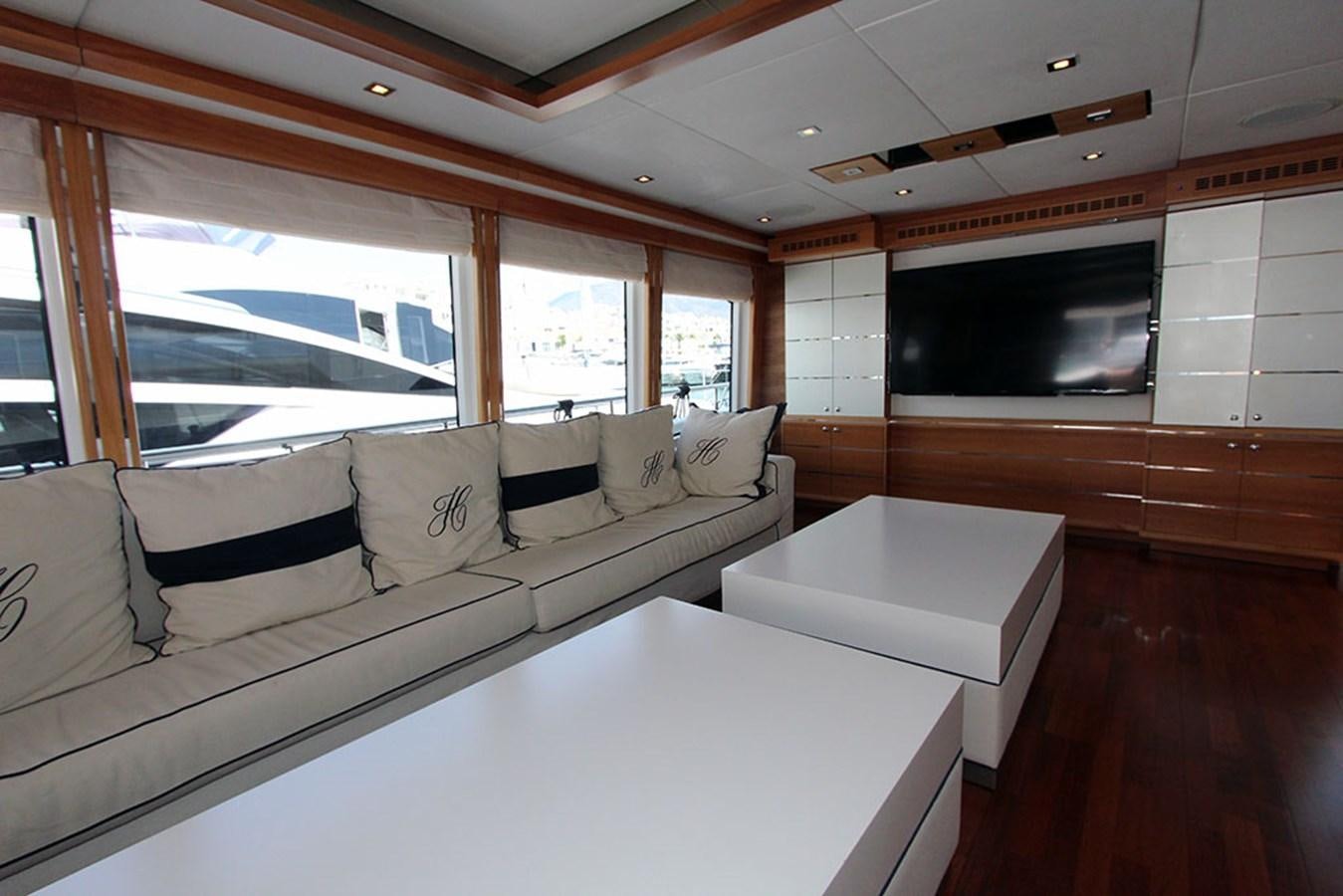 a living room with a couch and a television aboard HAIGAN Yacht for Sale