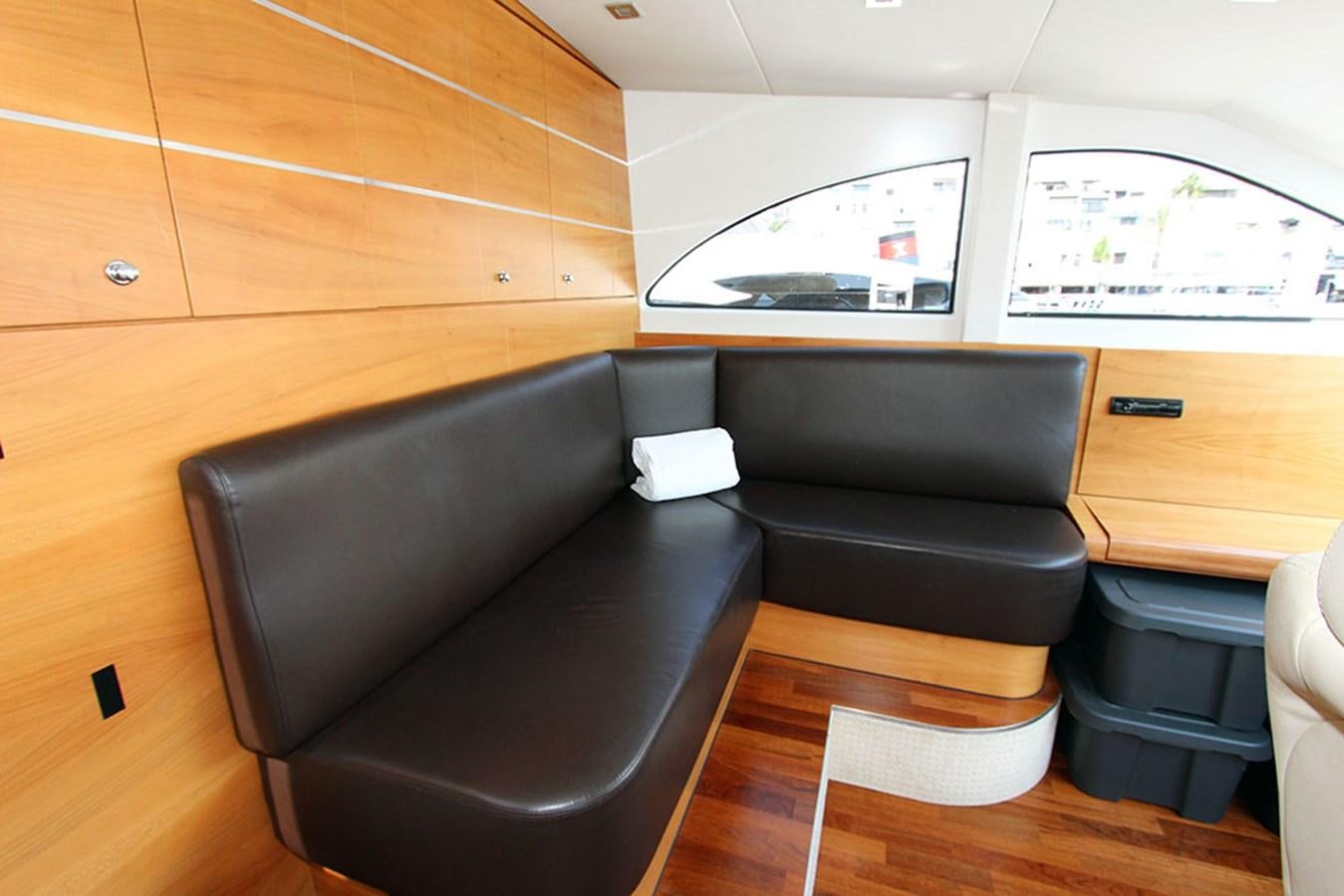 a room with a couch and a tv aboard HAIGAN Yacht for Sale