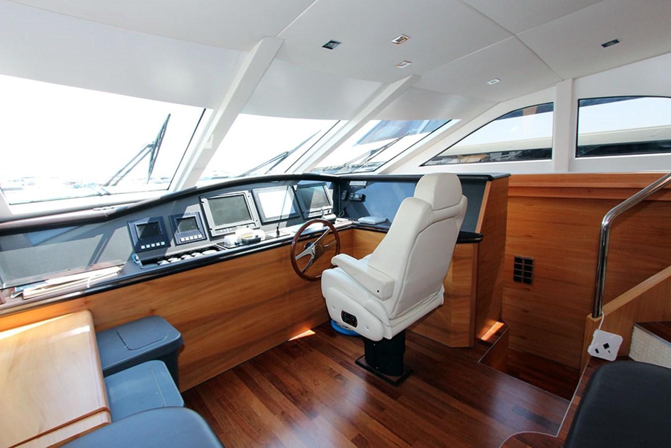 a room with a desk and chairs aboard HAIGAN Yacht for Sale