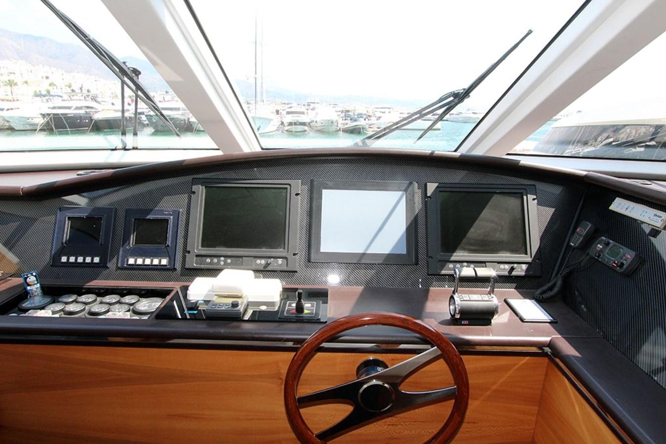 a group of monitors on a table aboard HAIGAN Yacht for Sale