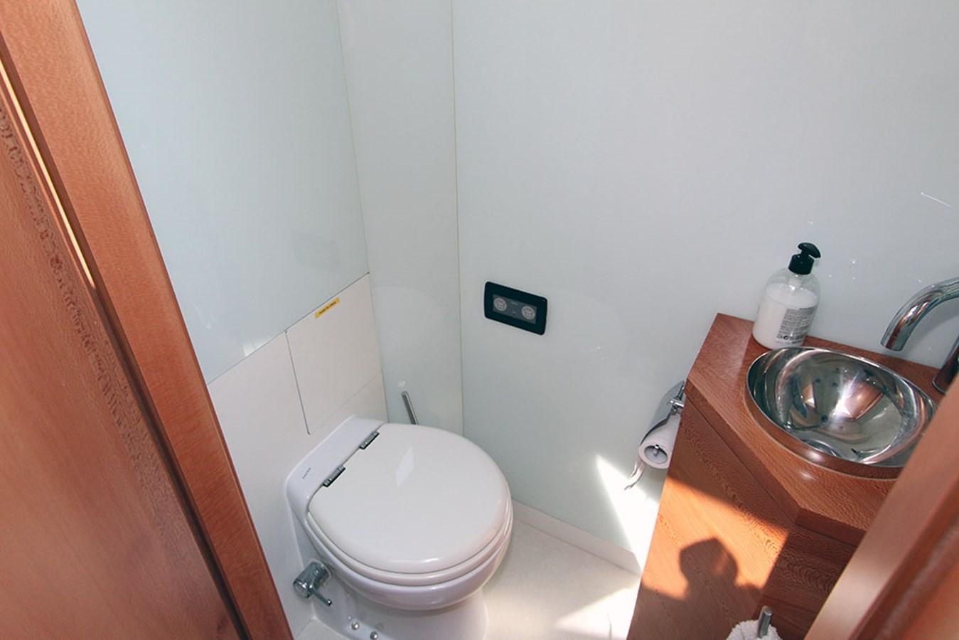 a bathroom with a toilet and sink aboard HAIGAN Yacht for Sale