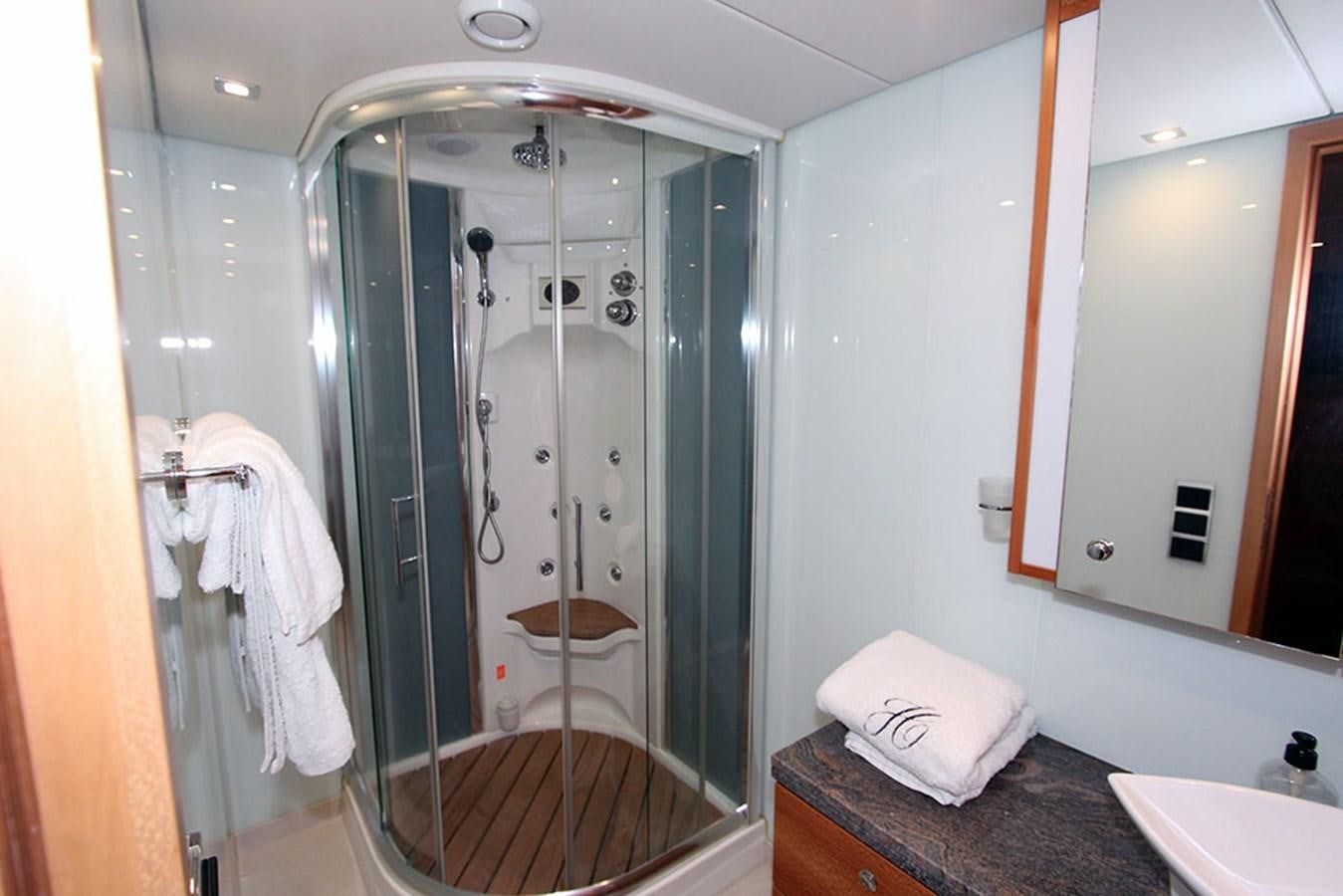 a bathroom with a glass shower aboard HAIGAN Yacht for Sale