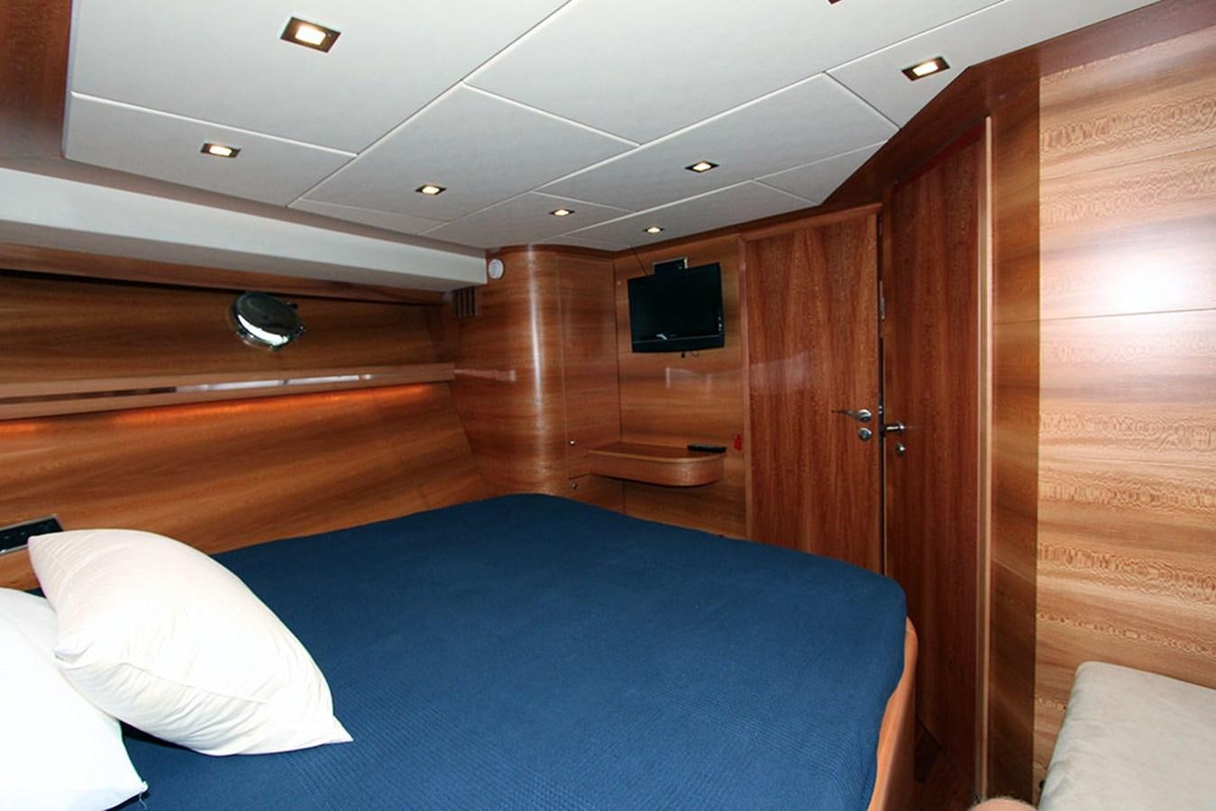a room with a bed and a television aboard HAIGAN Yacht for Sale