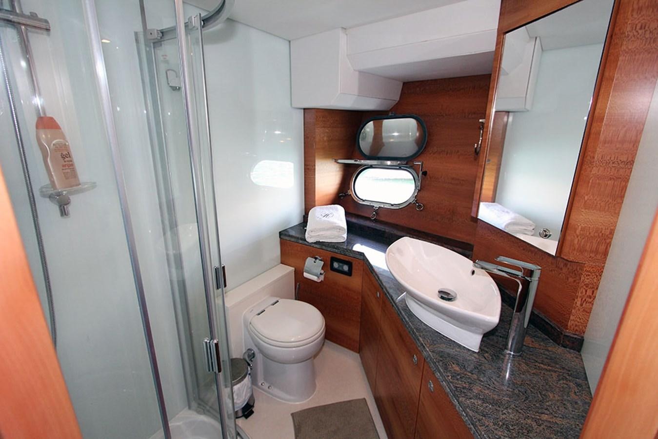 a bathroom with a toilet and a sink aboard HAIGAN Yacht for Sale