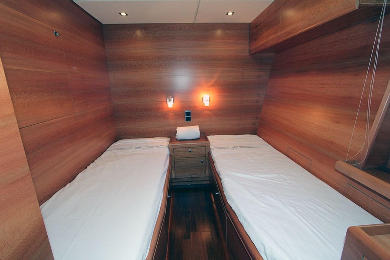 a room with a bed and a table aboard HAIGAN Yacht for Sale