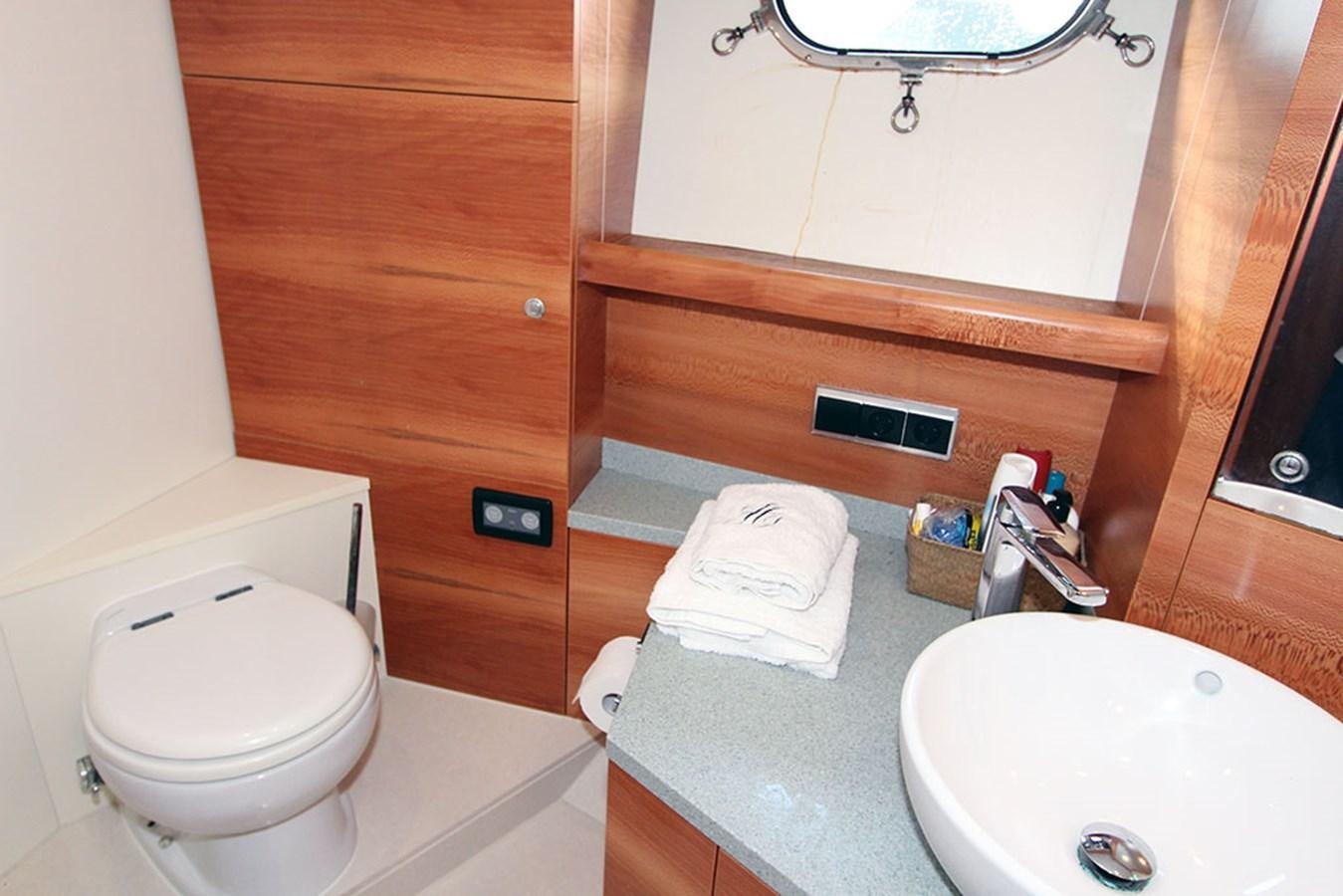 a bathroom with a sink and a toilet aboard HAIGAN Yacht for Sale