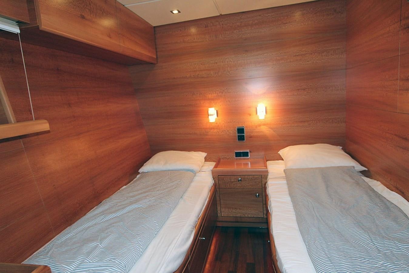 a couple of beds in a wood room aboard HAIGAN Yacht for Sale