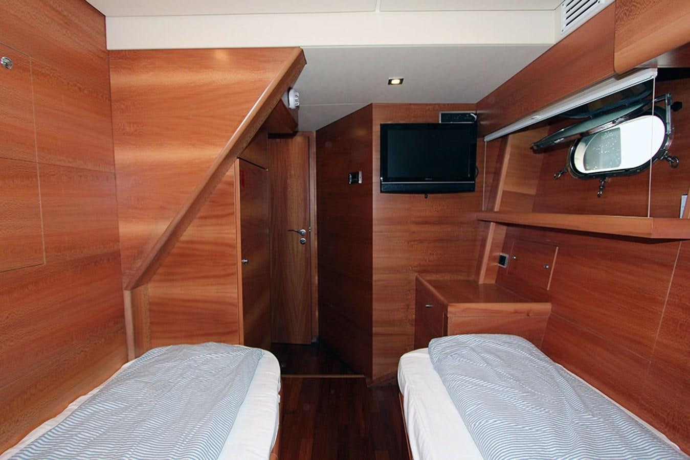 a room with a bed and a television aboard HAIGAN Yacht for Sale