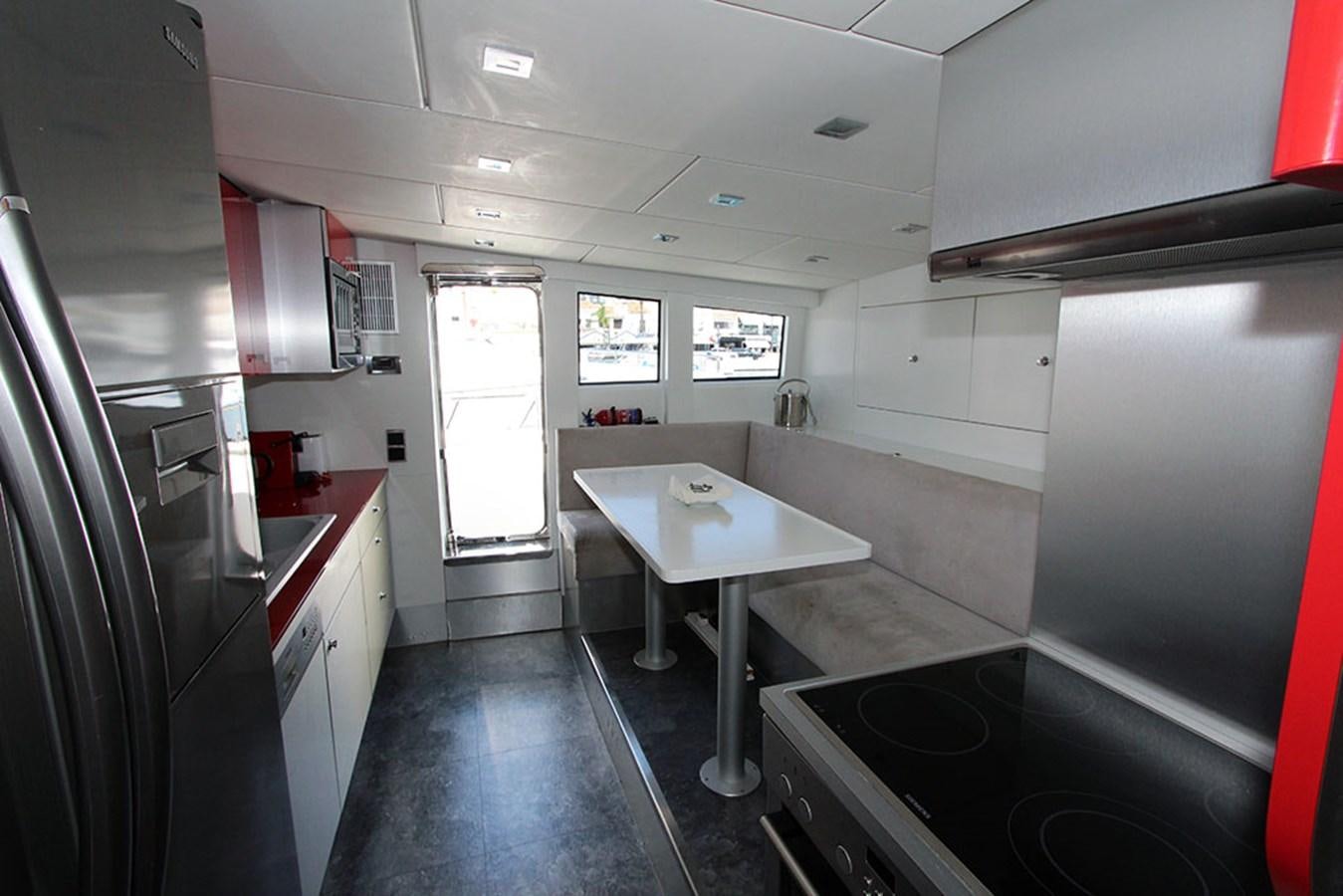 a kitchen with a sink and a window aboard HAIGAN Yacht for Sale