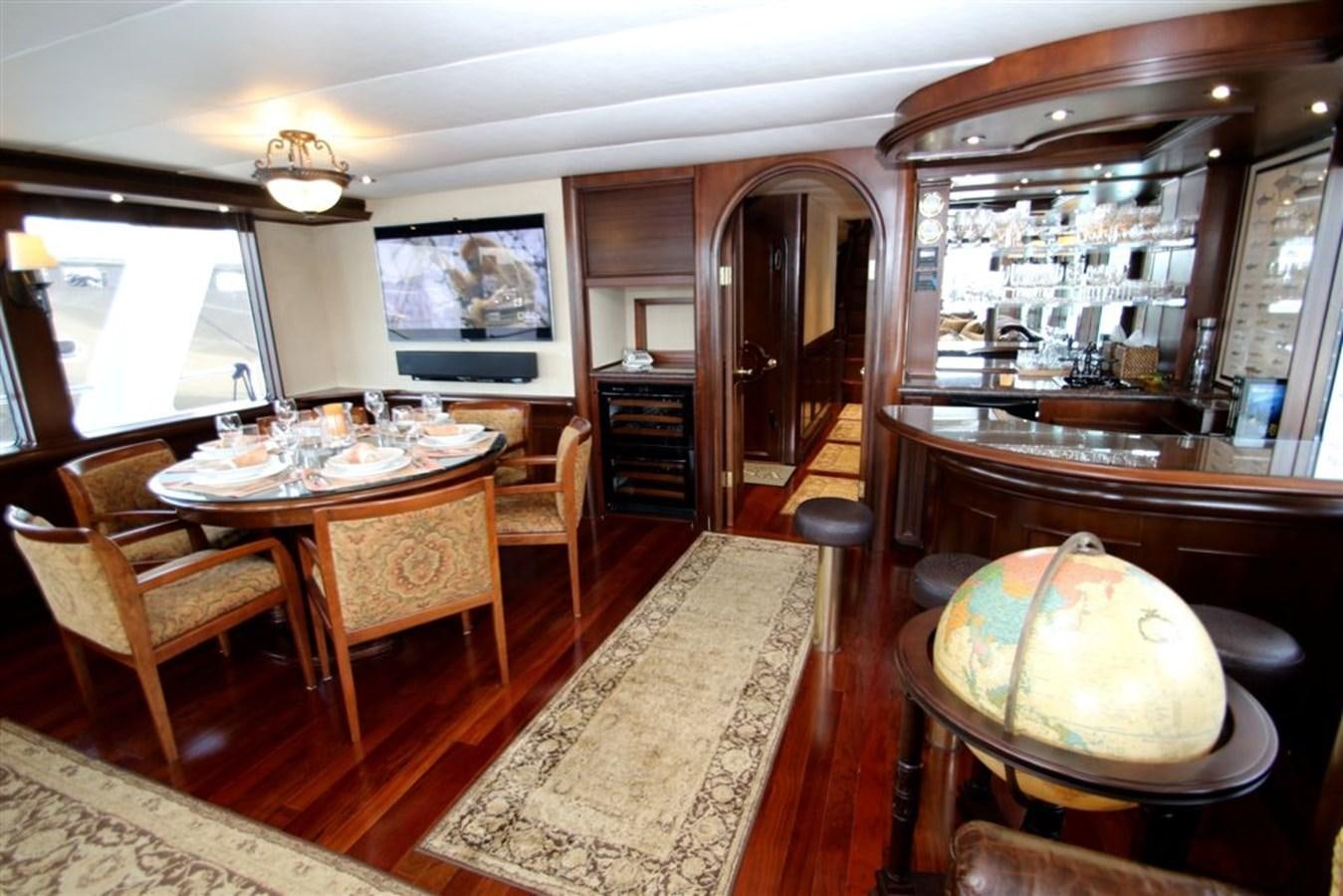 a dining room with a table and chairs aboard ROSA Yacht for Sale