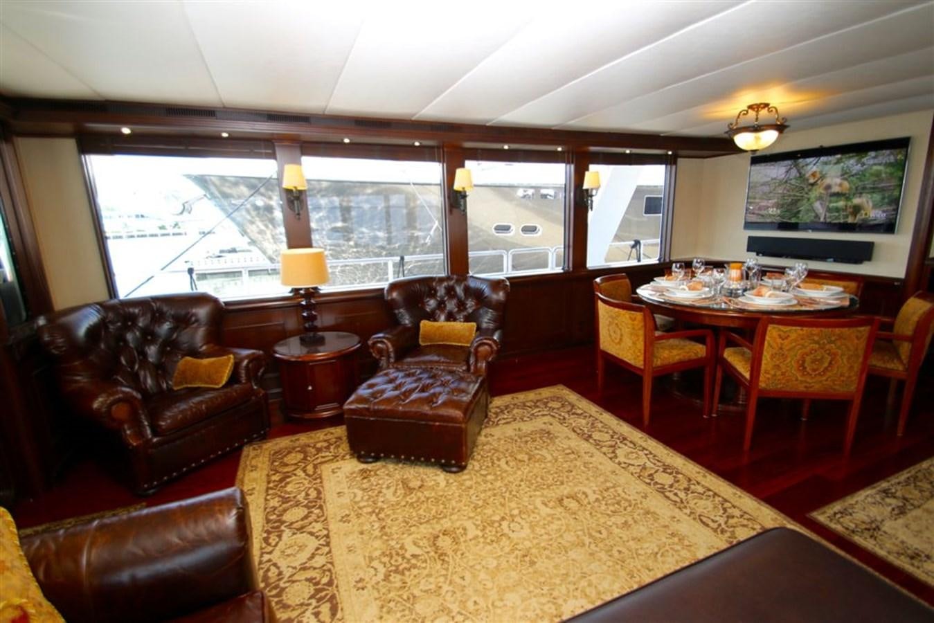 a living room with a large window aboard ROSA Yacht for Sale