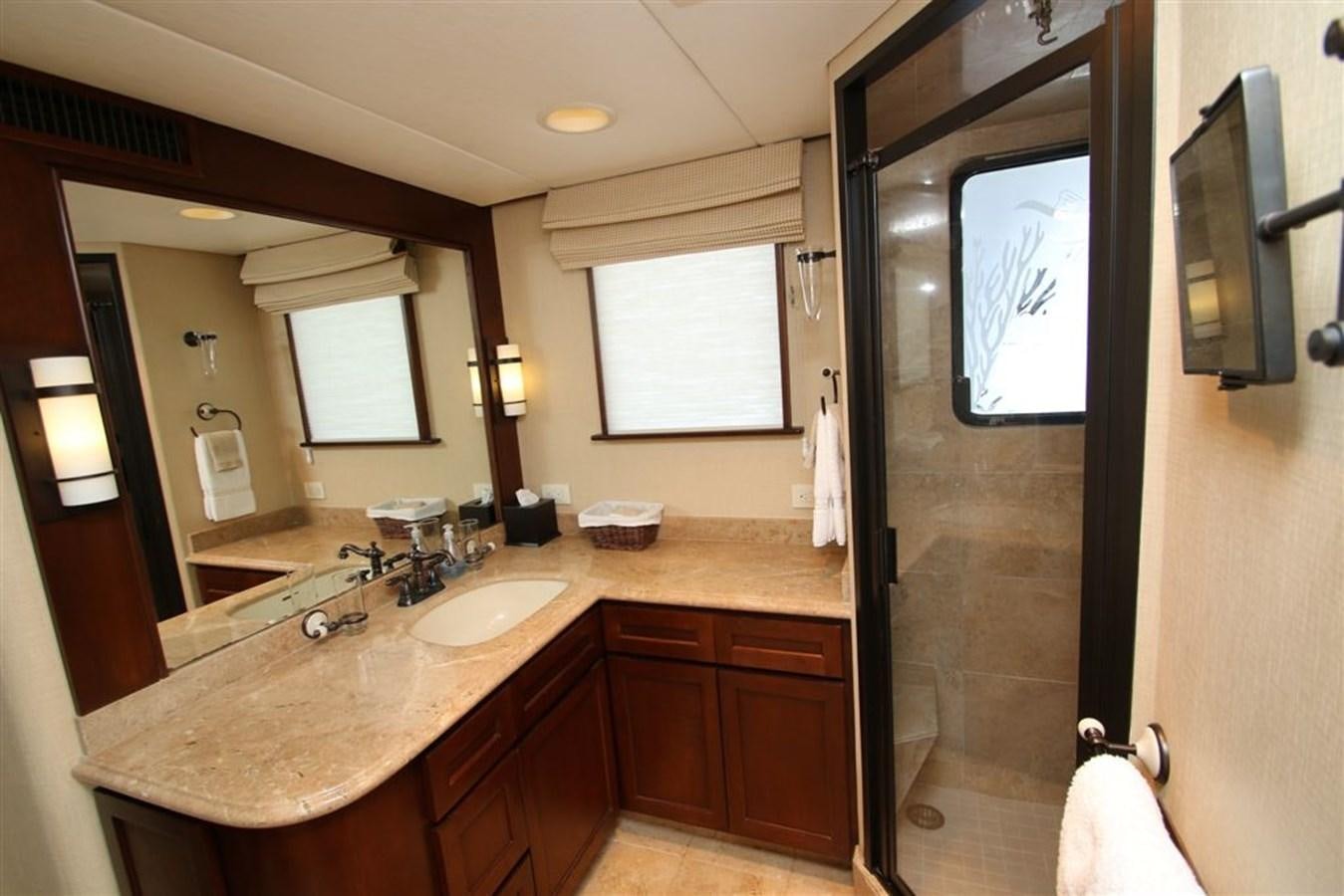 a bathroom with a countertop sink and a mirror aboard ROSA Yacht for Sale