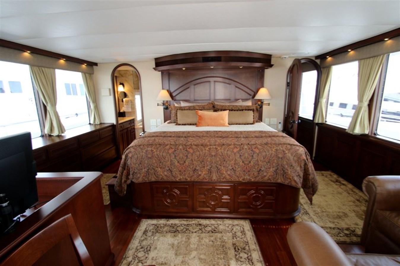 a large bed in a room aboard ROSA Yacht for Sale