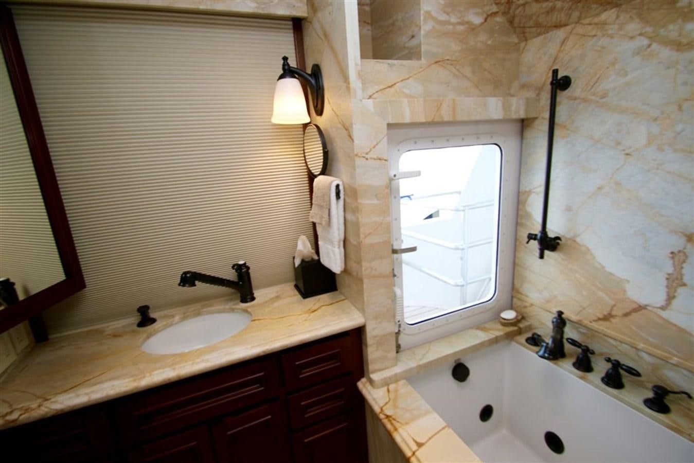 a bathroom with a sink and a mirror aboard ROSA Yacht for Sale