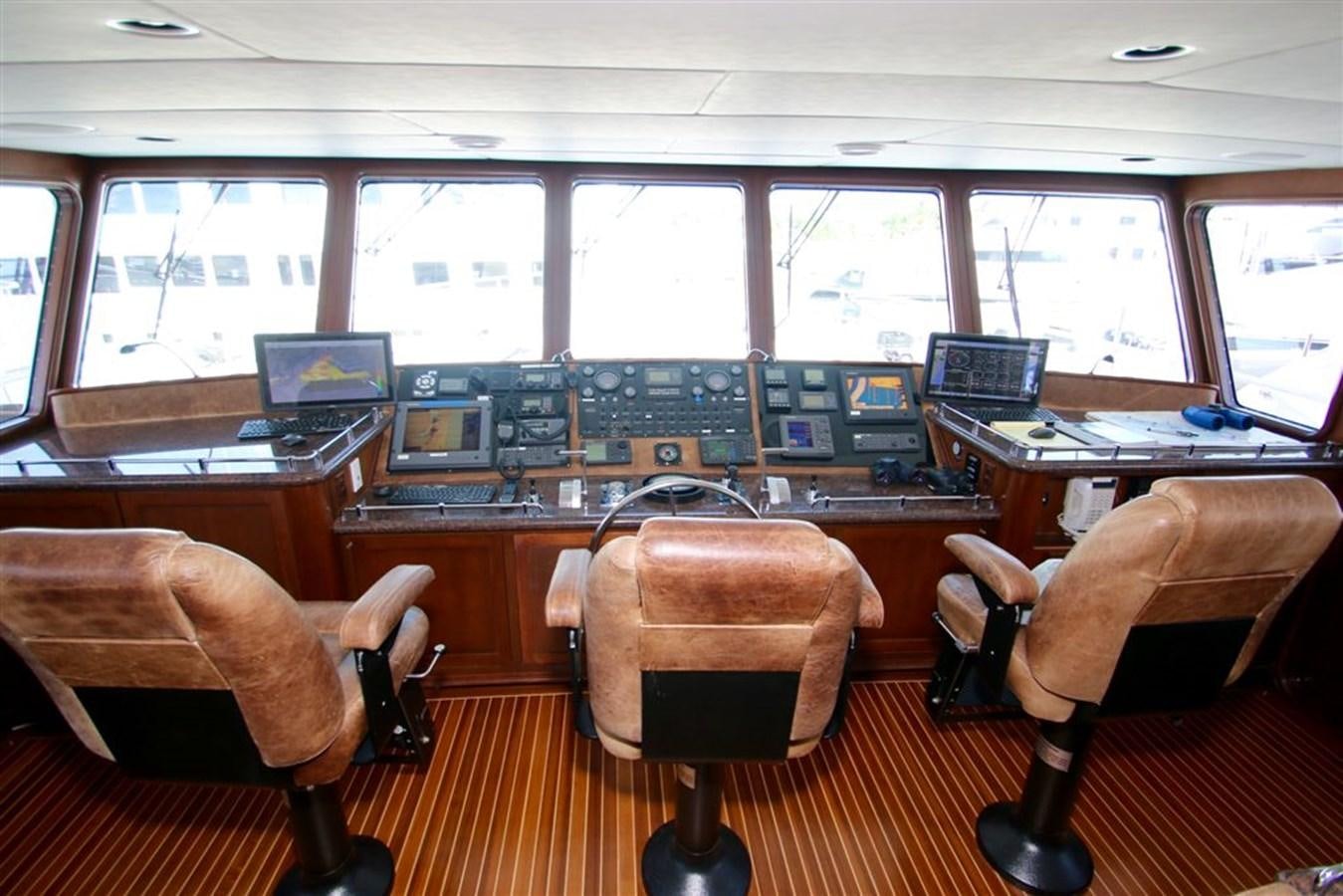 a room with many computers and chairs aboard ROSA Yacht for Sale