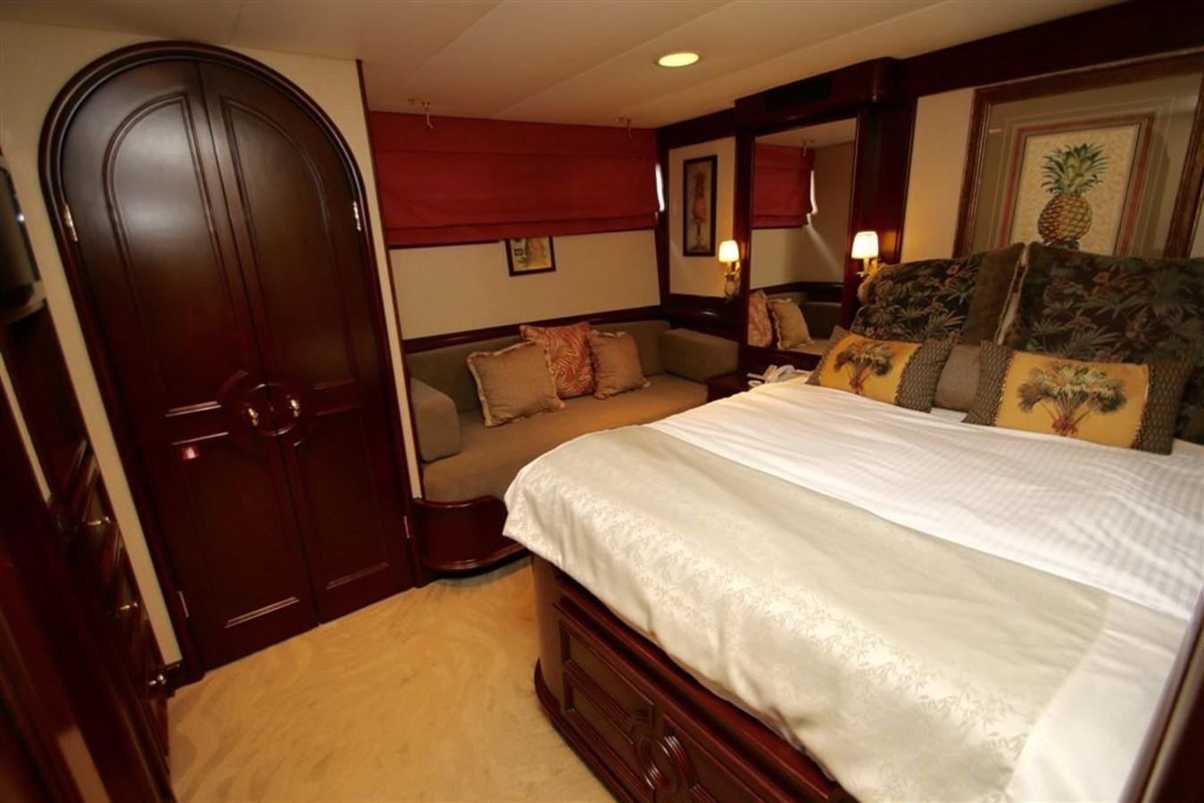 a bedroom with two beds aboard ROSA Yacht for Sale