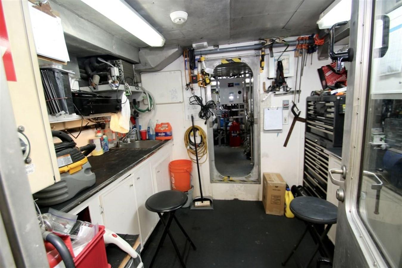 a room with a sink and a lot of tools and equipment aboard ROSA Yacht for Sale
