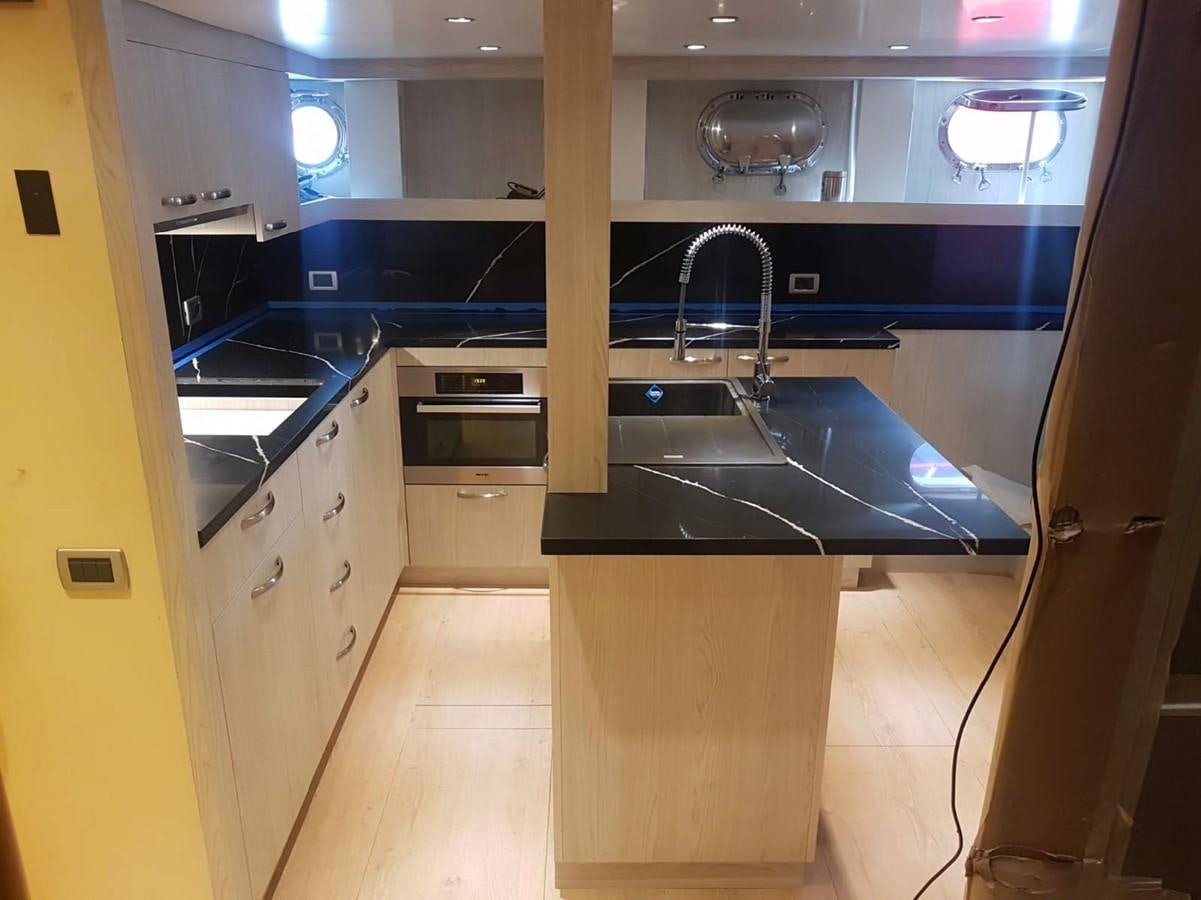 a kitchen with a sink and cabinets aboard LADY MIKKI Yacht for Sale