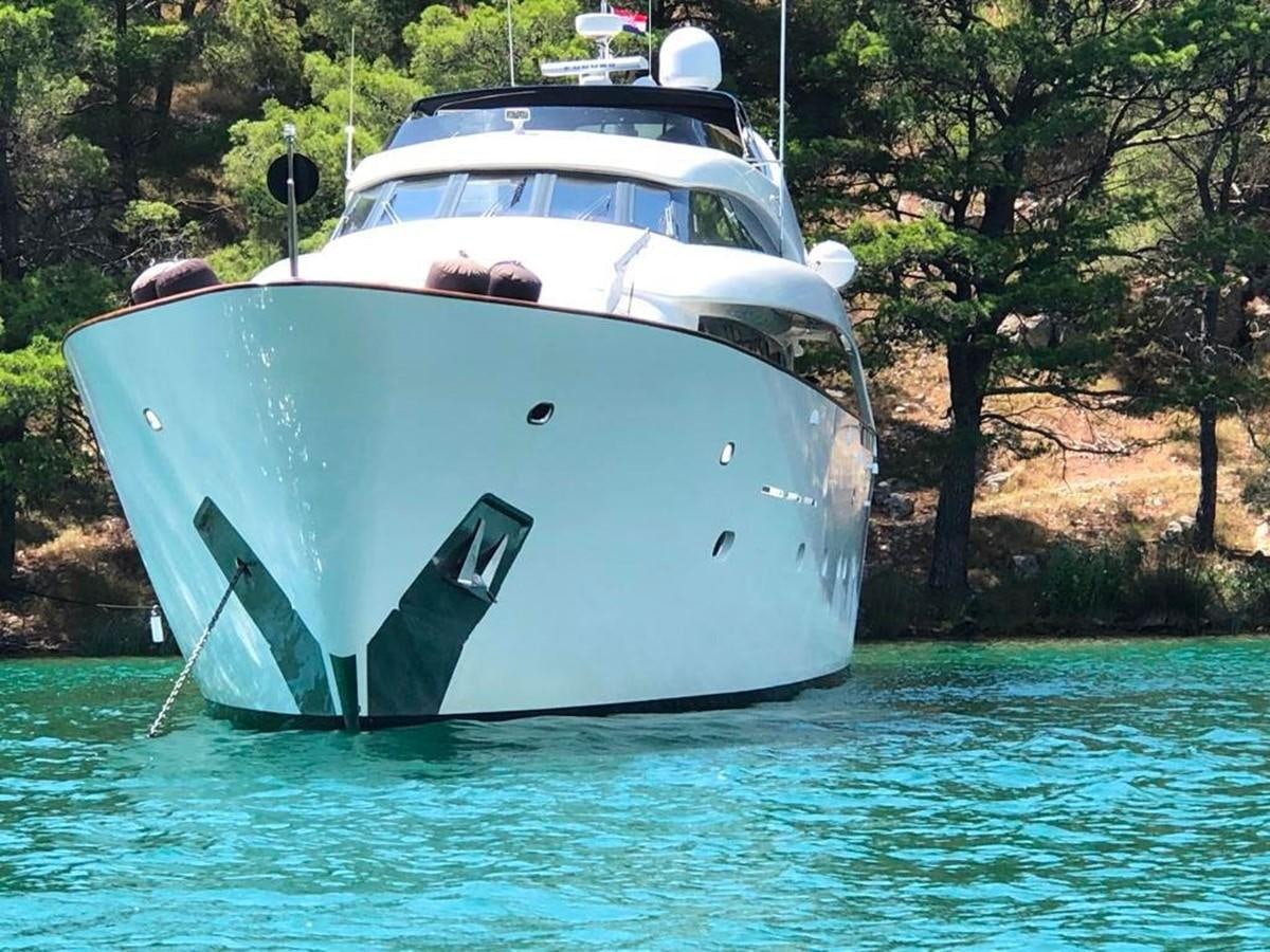 a white boat in a body of water aboard LADY MIKKI Yacht for Sale