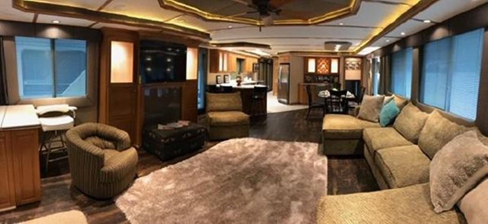 a living room with a large window aboard FANTASY HOUSEBOAT Yacht for Sale