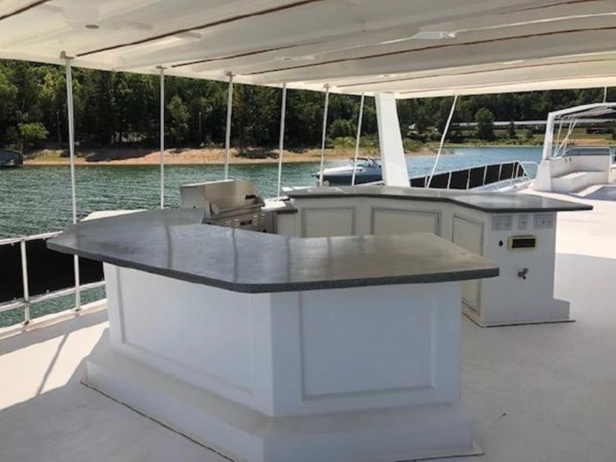 a white rectangular object with a black surface and a white surface with a white surface and a white aboard FANTASY HOUSEBOAT Yacht for Sale