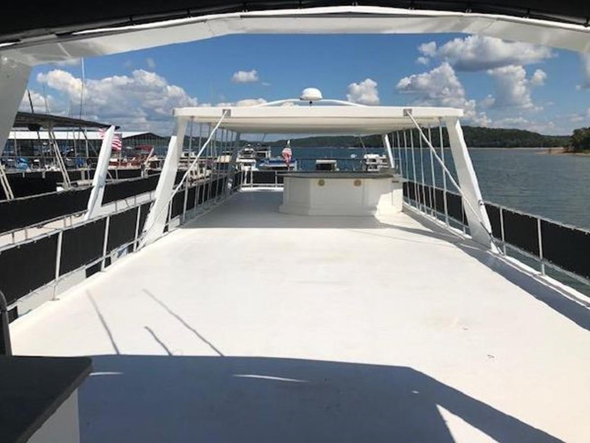 a person on a boat aboard FANTASY HOUSEBOAT Yacht for Sale