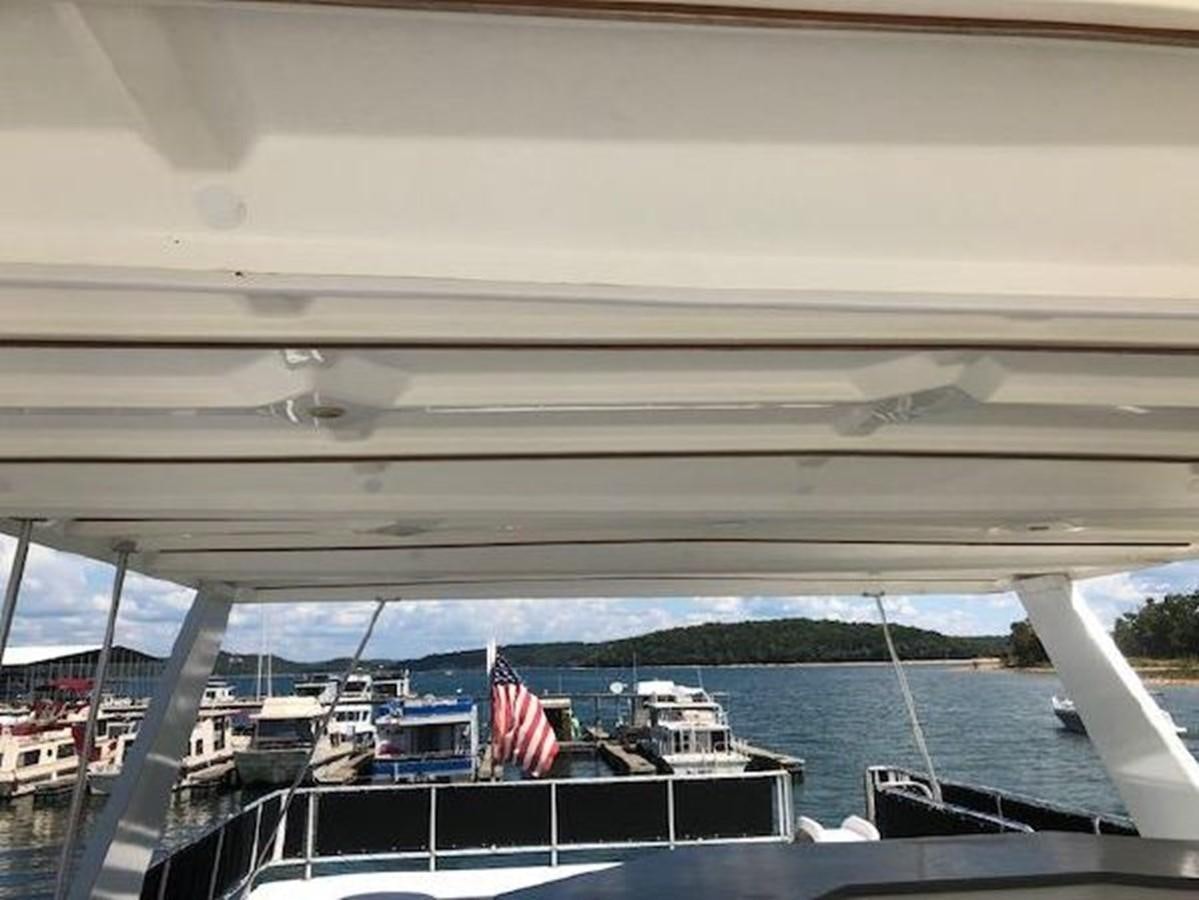 a flag on a boat aboard FANTASY HOUSEBOAT Yacht for Sale