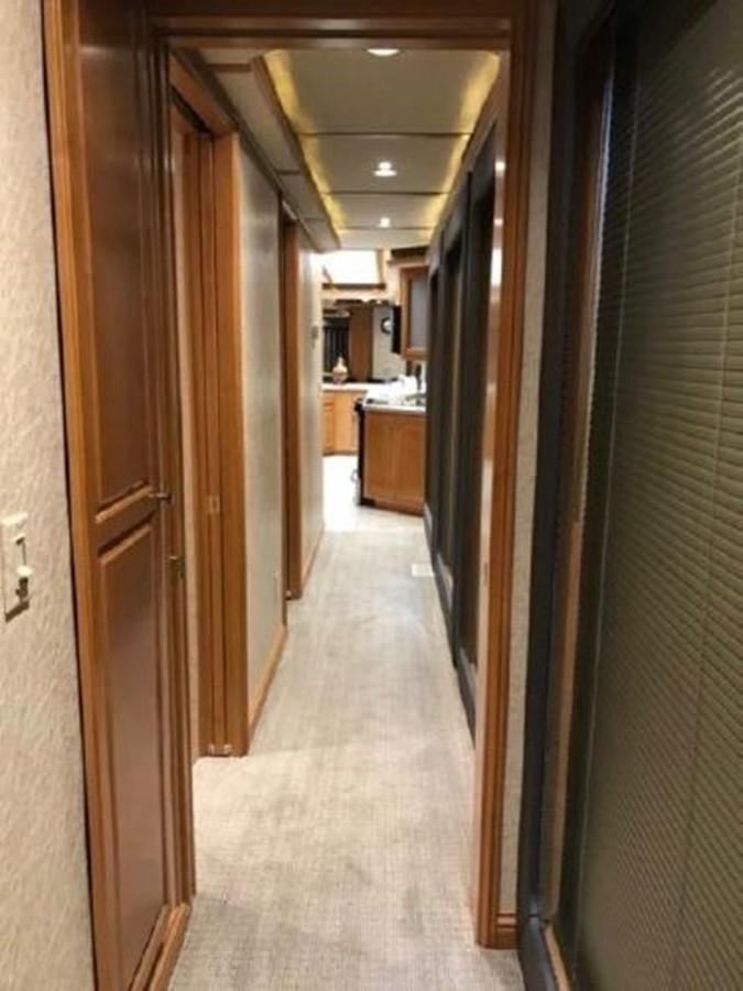 a hallway with doors aboard FANTASY HOUSEBOAT Yacht for Sale