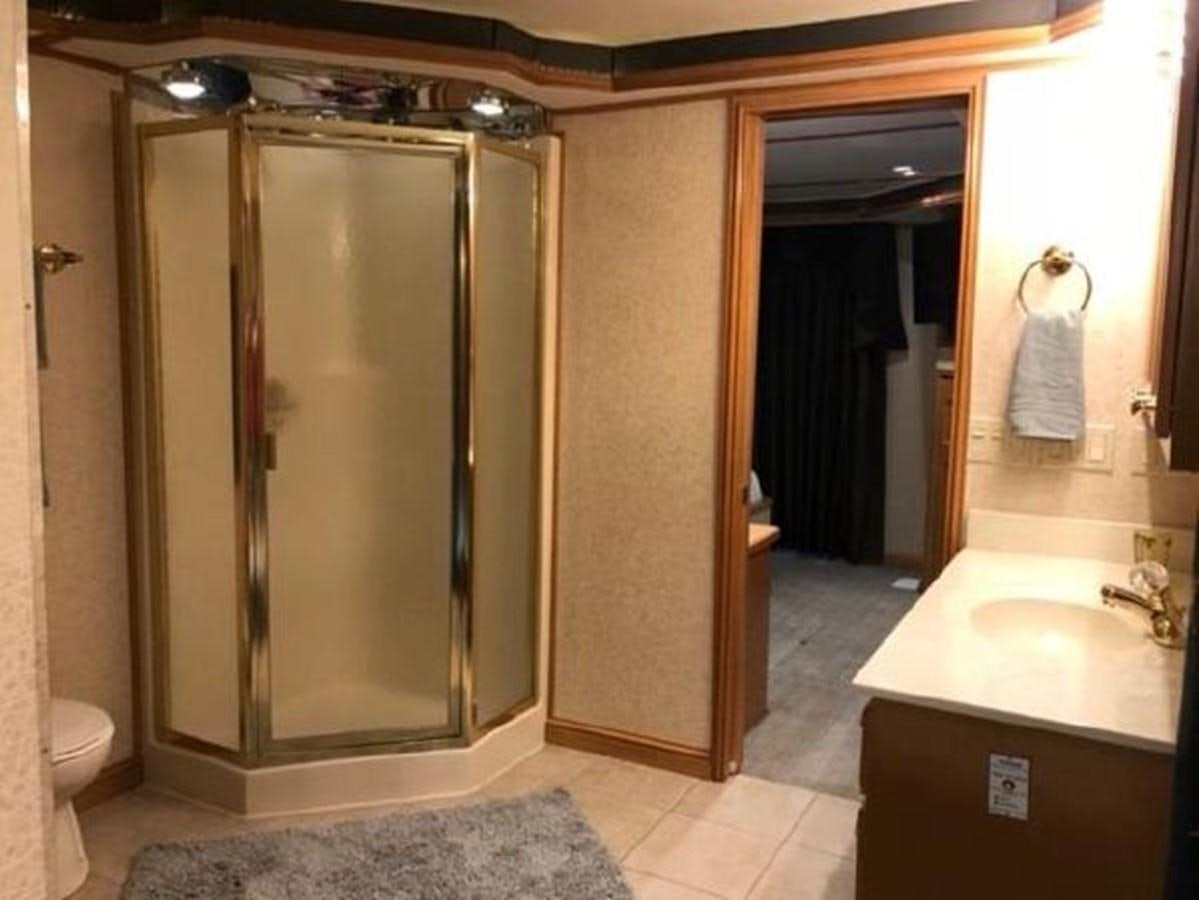 a bathroom with a shower unit aboard FANTASY HOUSEBOAT Yacht for Sale